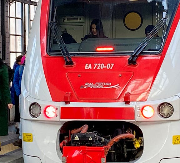 Malpensa Express train at station platform, connecting to Malpensa Airport.