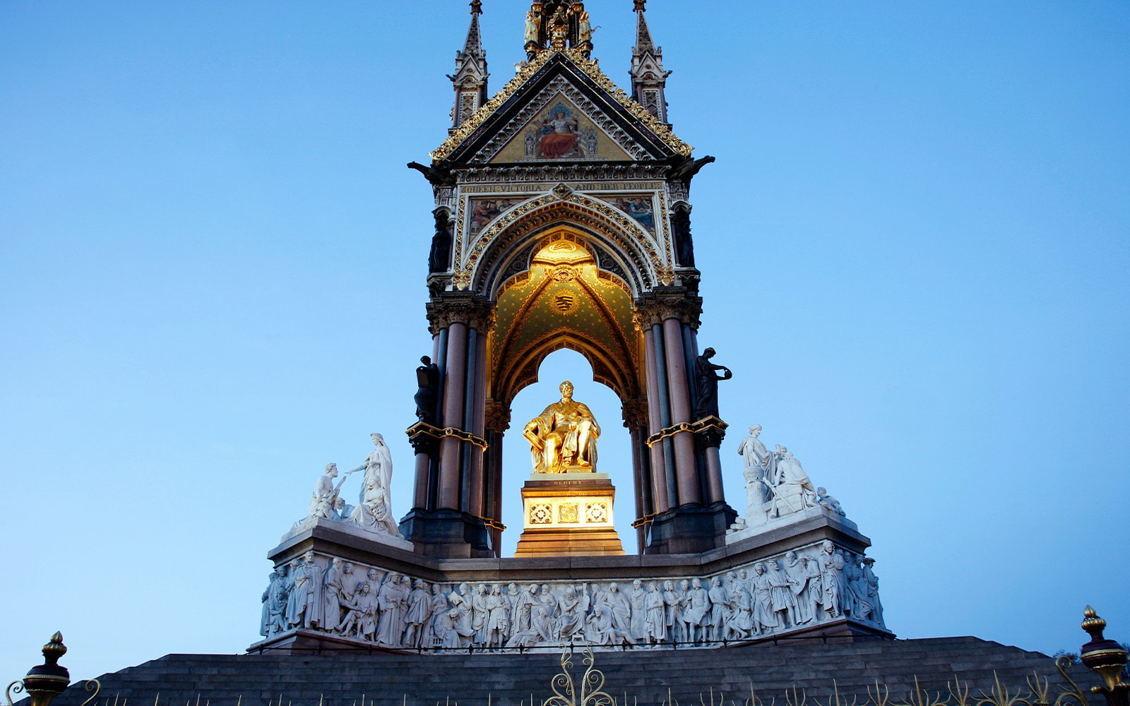 Albert Memorial in Hyde Park, London, featuring a gilded statue of Prince Albert under an ornate canopy.