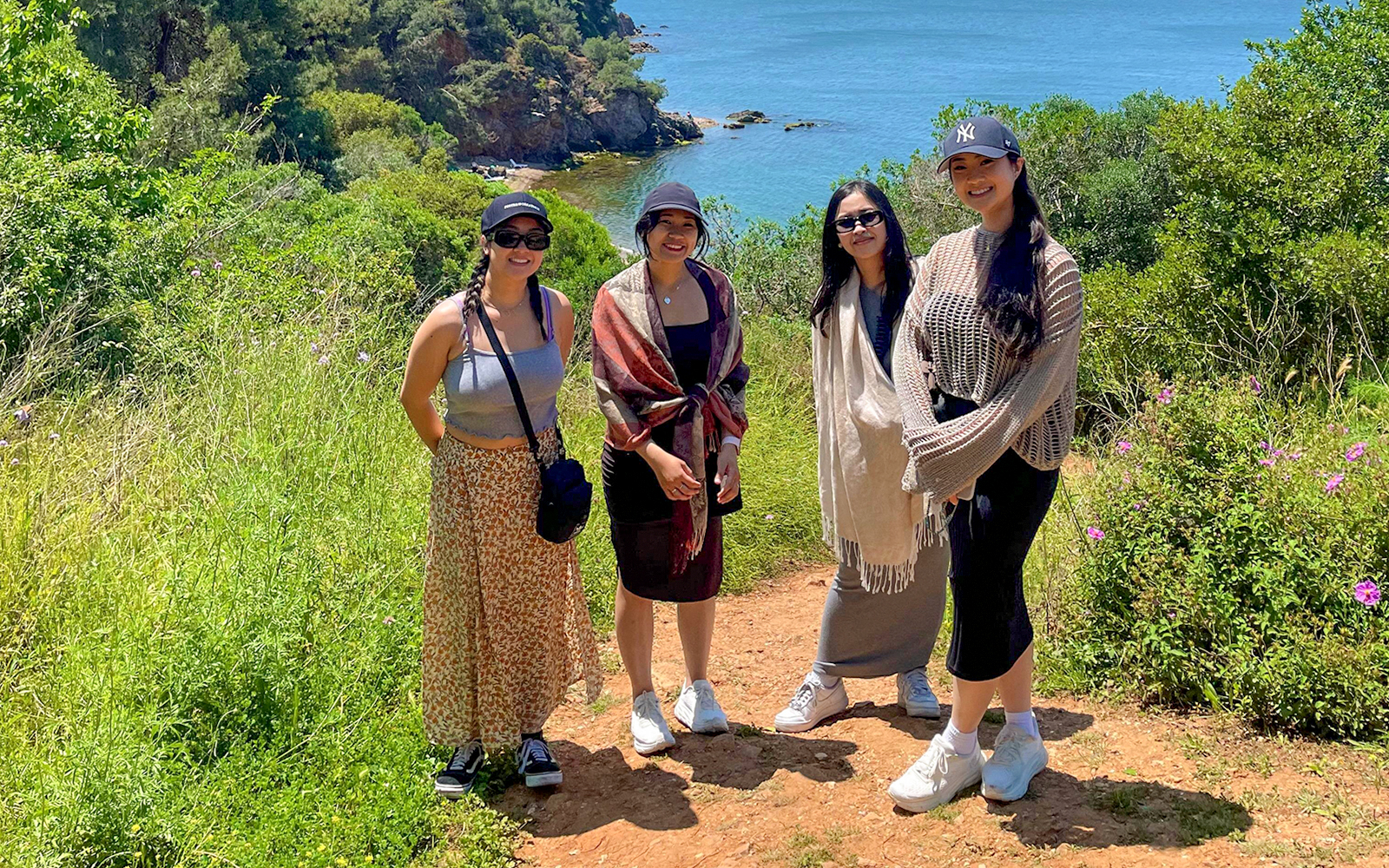 Guests enjoying a scenic walk on Princess Island with a view of the sea and lush greenery.