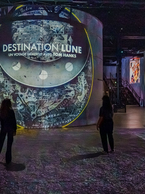 Moonwalkers Exhibition at Atelier des Lumières with immersive lunar projections.