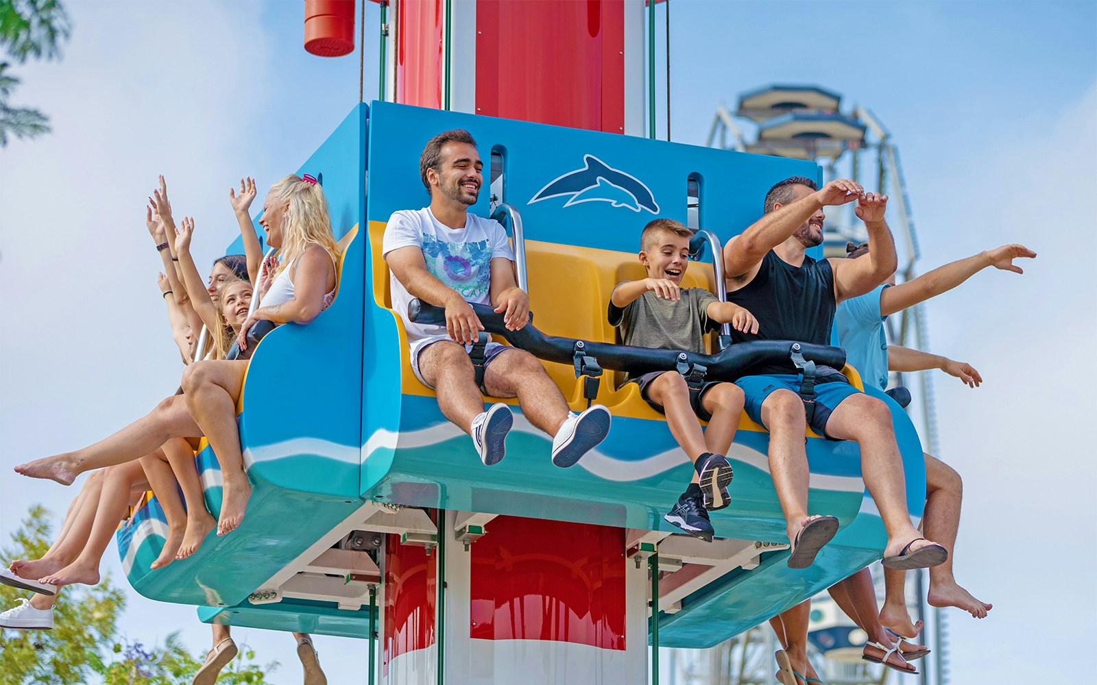 Dolphin show at Zoomarine in Albufeira, Portugal, with dolphins leaping from the water.