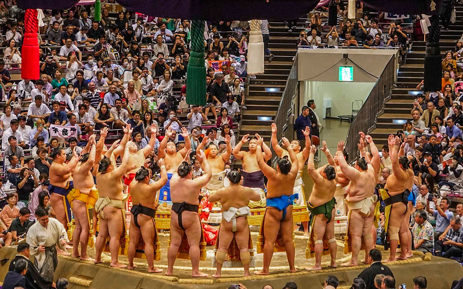 Sumo wrestlers perform a ring-entering ceremony at Ryogoku, Tokyo tournament.