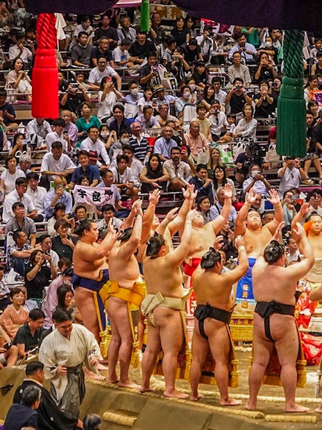 Sumo wrestlers perform a ring-entering ceremony at Ryogoku, Tokyo tournament.