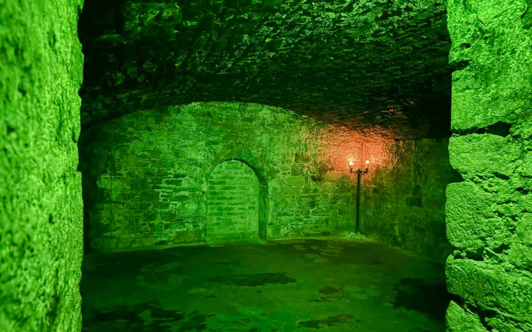 Underground vault with stone walls and archway, Niddry Street, Edinburgh.