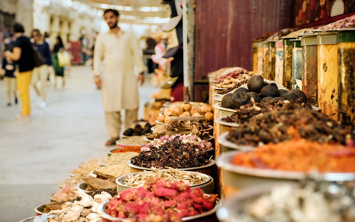 Spices displayed in a Dubai market, part of the Dubai Super Saver Pass experience.