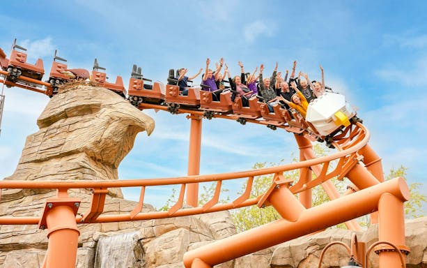 Roller coaster at LEGOLAND Billund with riders enjoying the thrill.