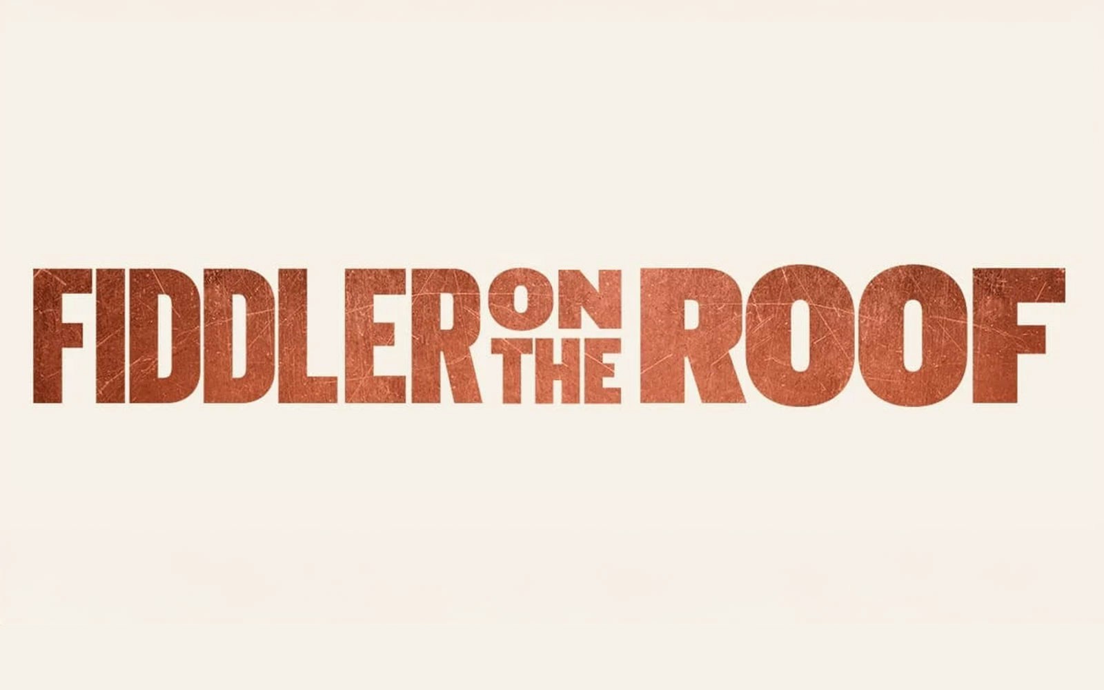 Fiddler on the Roof logo in bold red letters