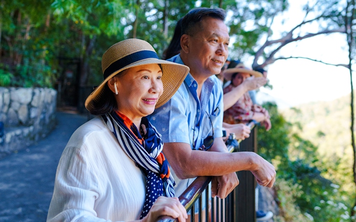 Tourists enjoying the view on the Natural Bridge & Springbrook Waterfalls Tour.