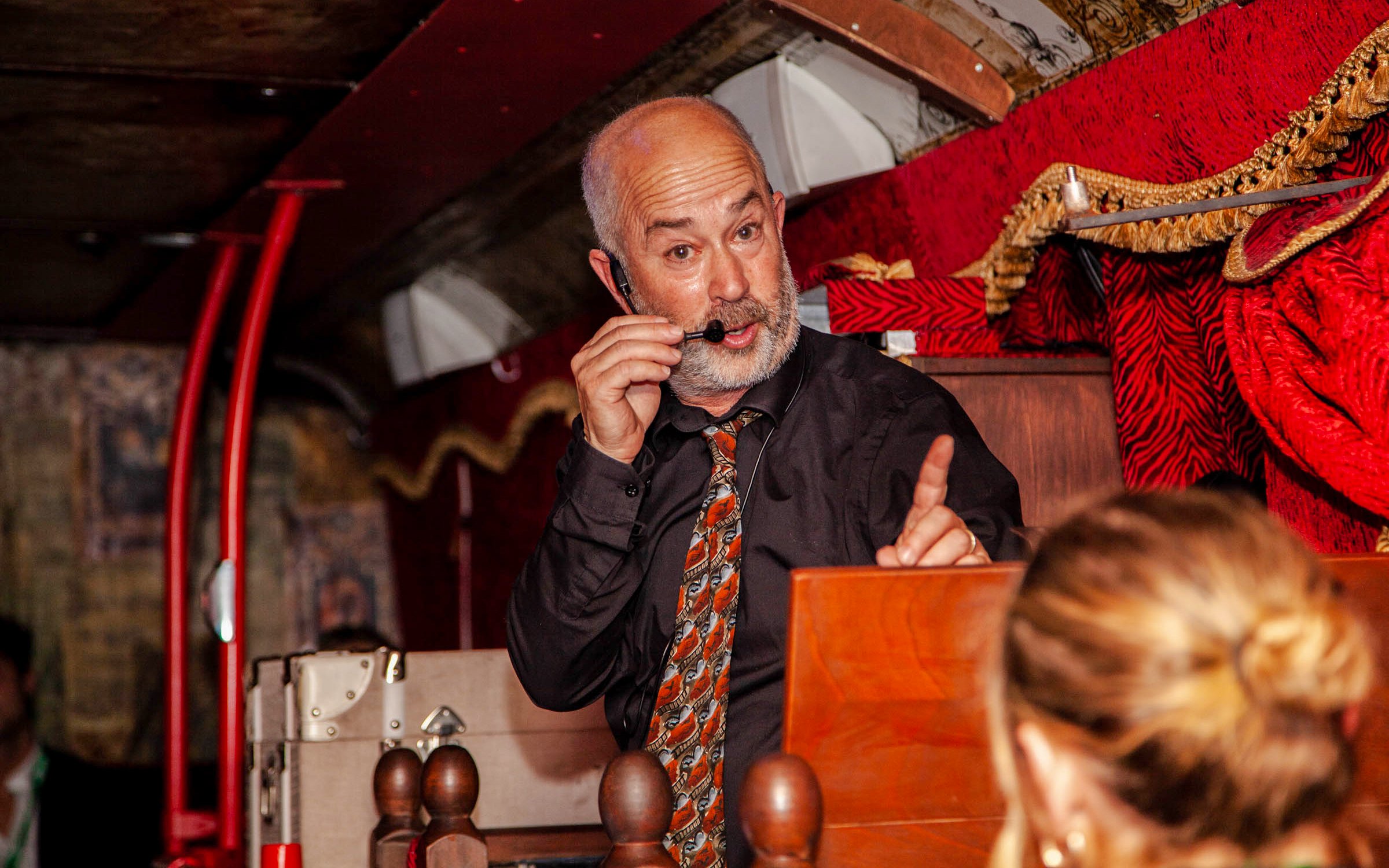 Tour guide narrating on the Dublin Ghostbus Tour.