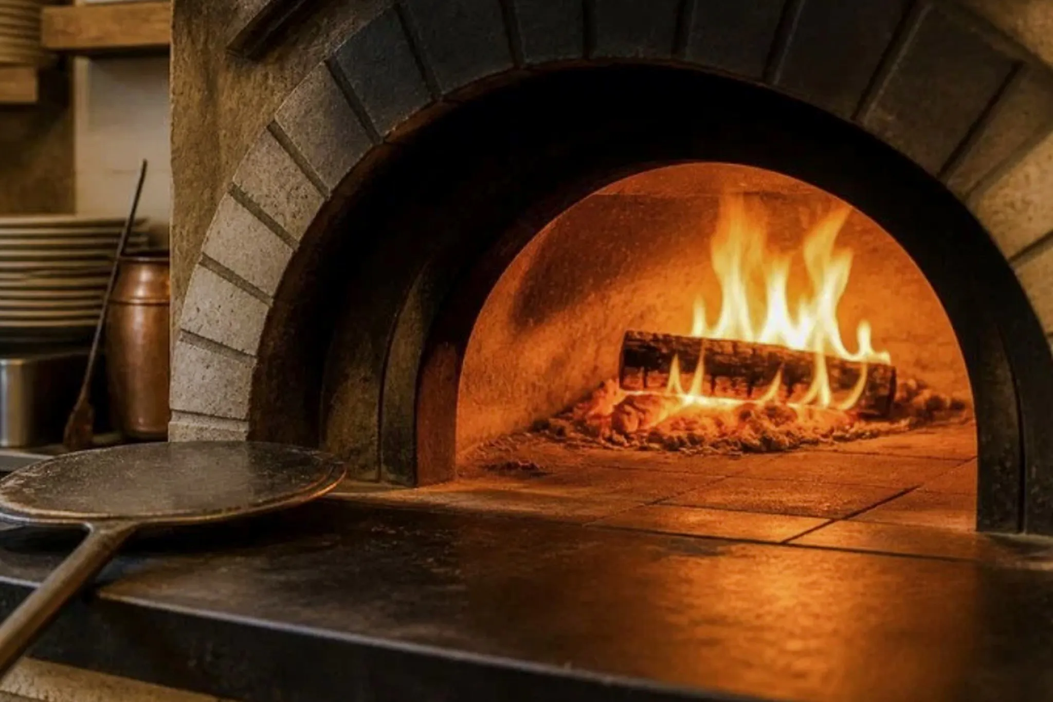 Wood-fired oven used in pasta and tiramisu cooking class, Florence walking tour.