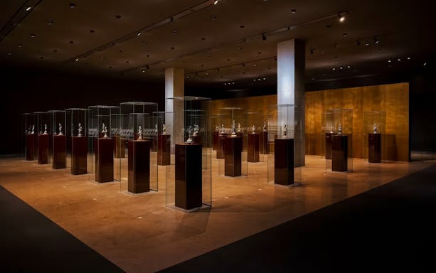 Hōryū-ji Treasures exhibit at Tokyo National Museum, Japan, featuring artifacts in glass cases.