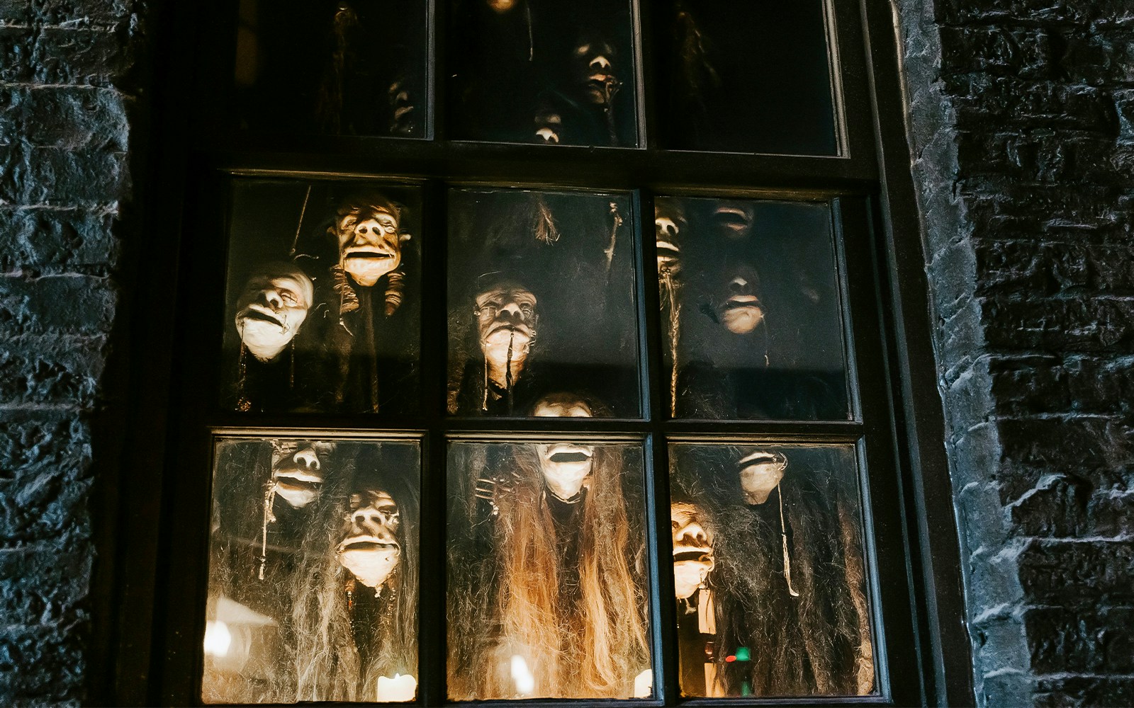 Shrunken heads in a window at The Wizarding World of Harry Potter, Diagon Alley, Orlando.