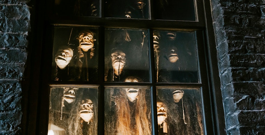 Shrunken heads in a window at The Wizarding World of Harry Potter, Diagon Alley, Orlando.