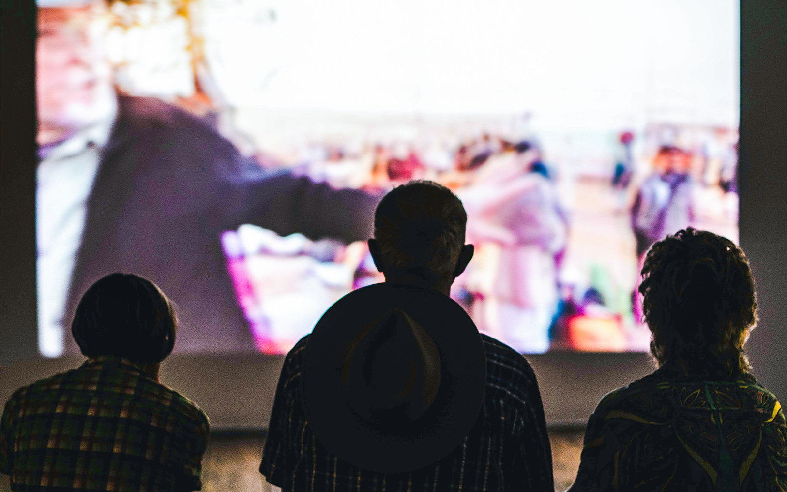 Audience watching a film in a generic cinema hall.