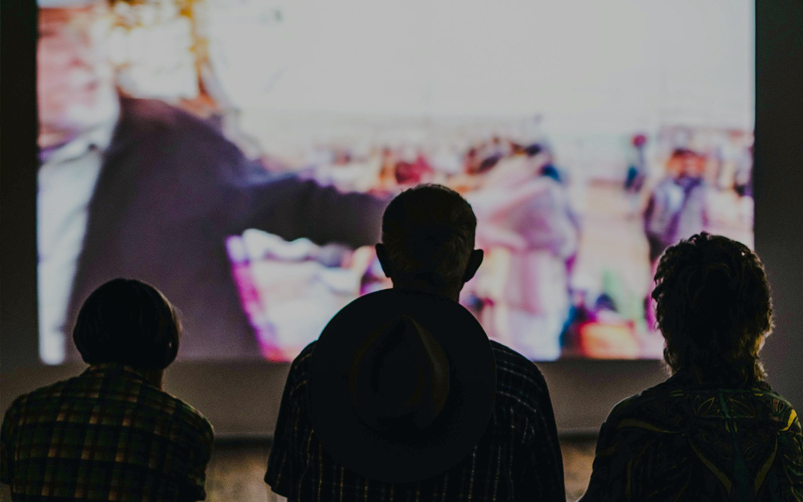 Audience watching a film in a generic cinema hall.