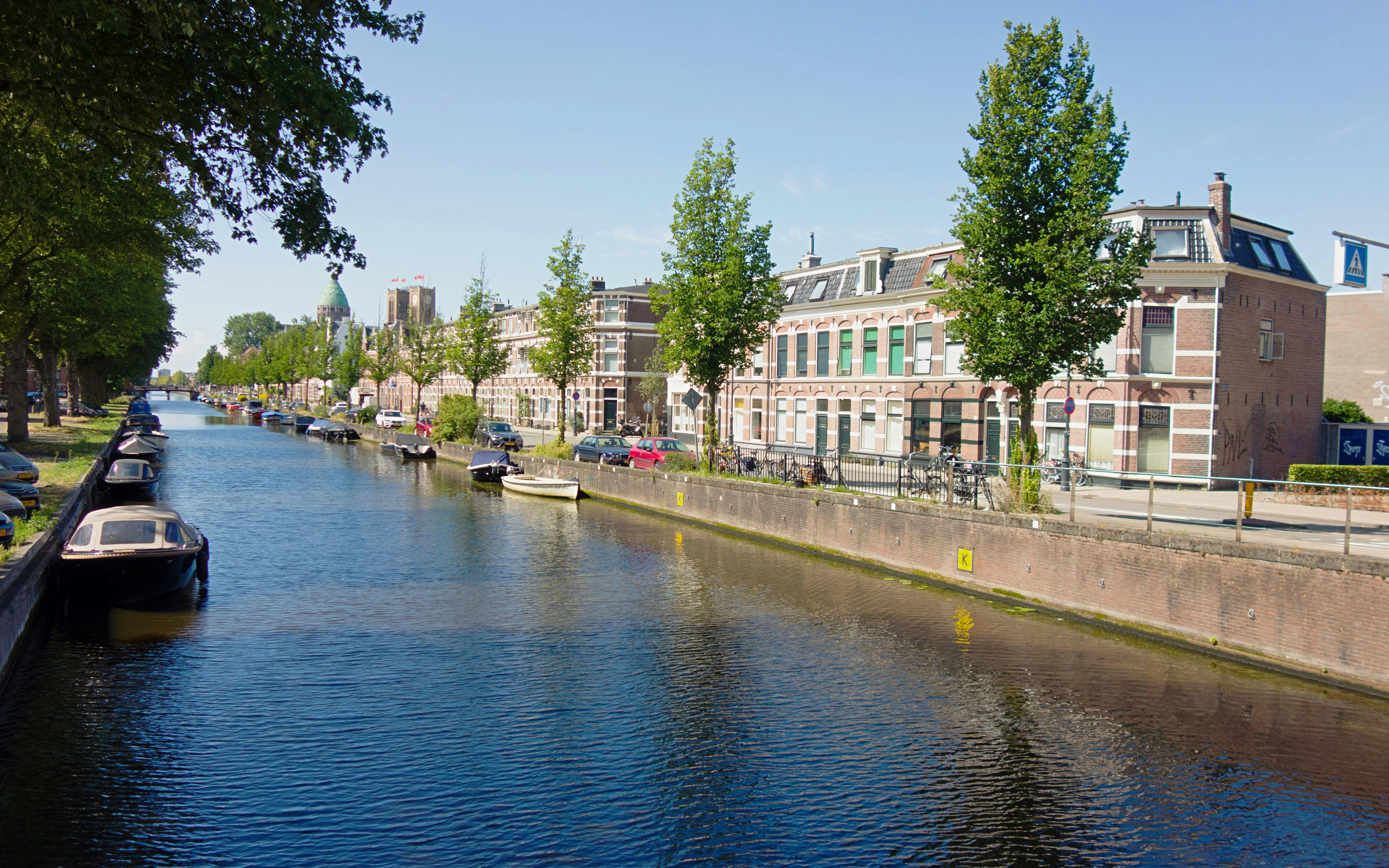 Canal view along Leidsevaart with boats and historic buildings in the Netherlands.