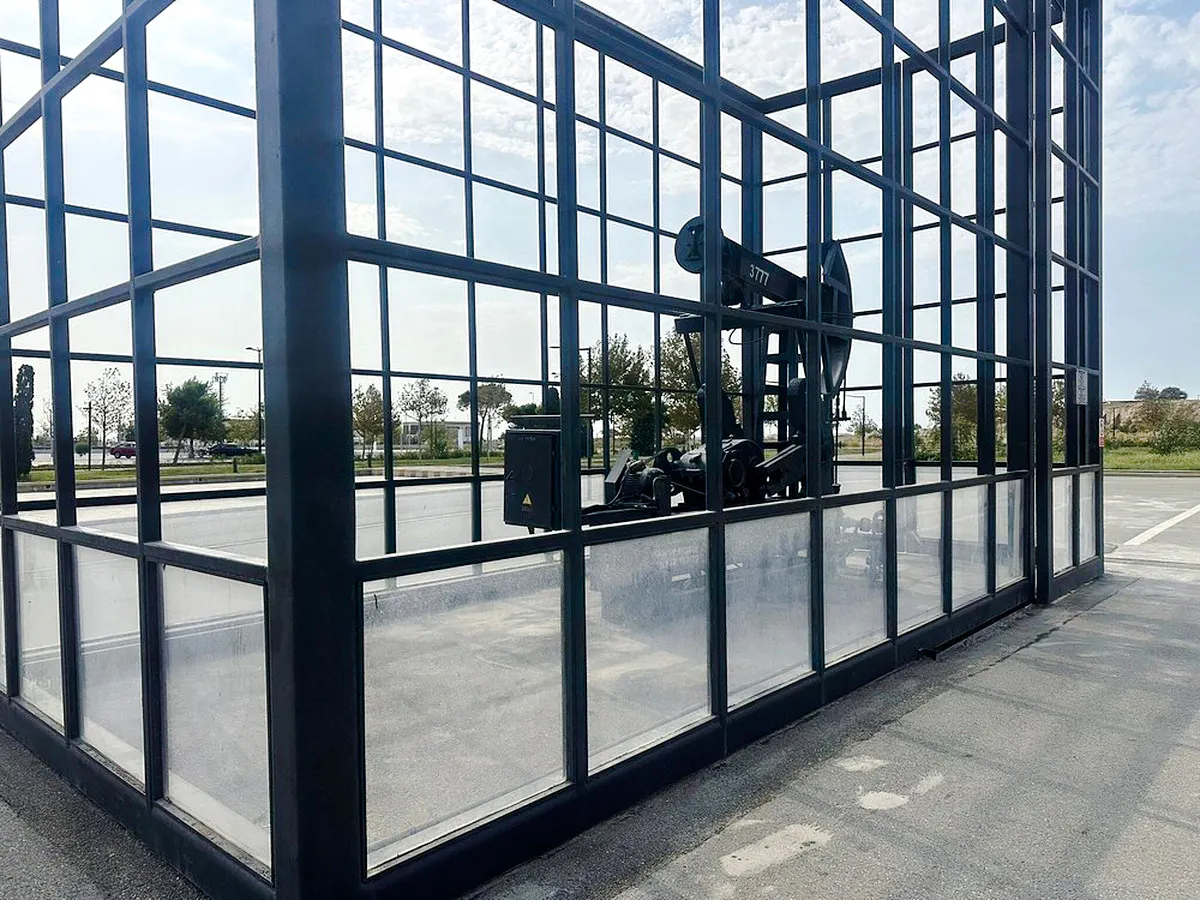 Oil pumpjack encased in glass at Gobustan National Park, Baku.