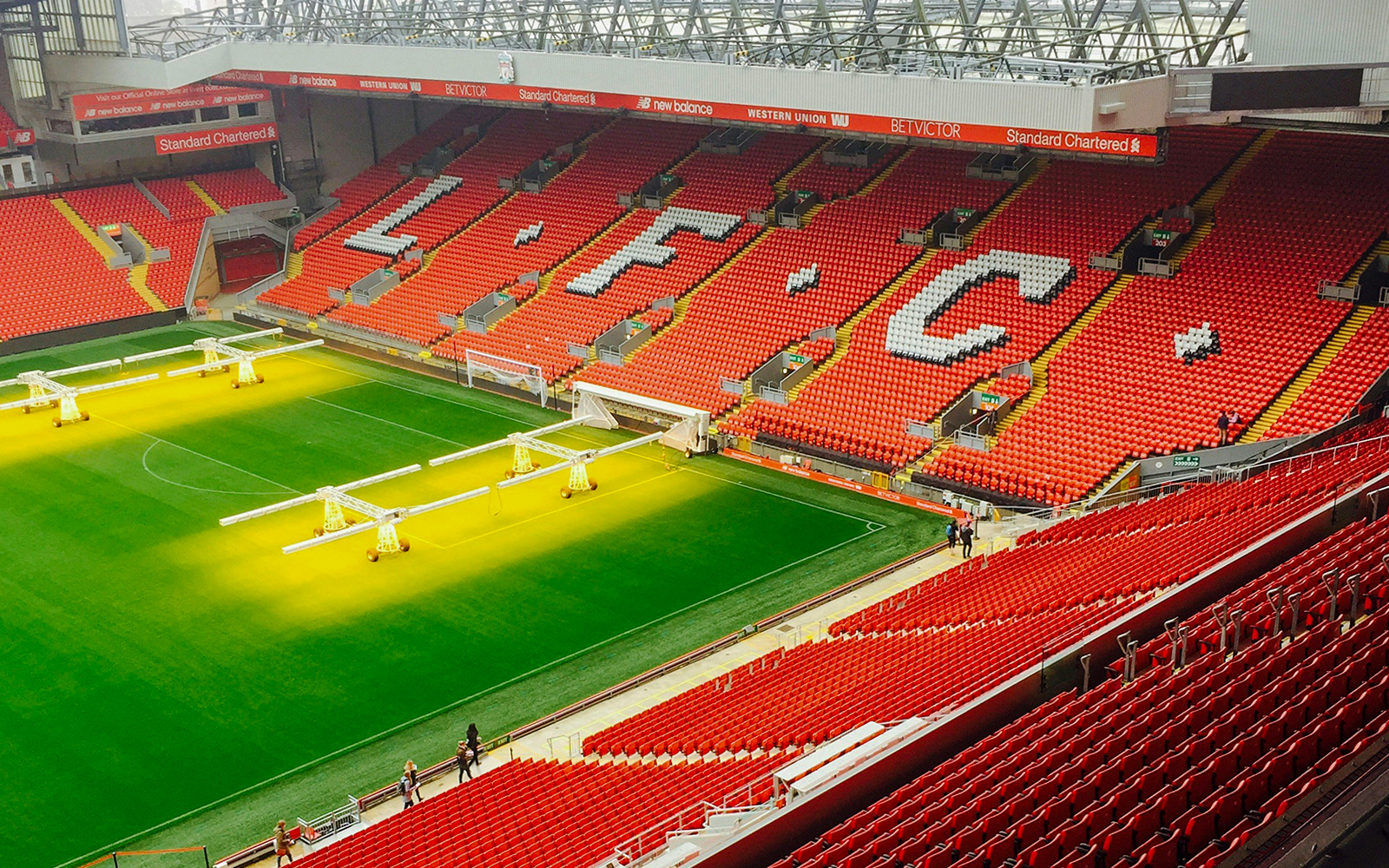 Stands at Anfield Stadium, Liverpool with red seats and LFC letters.