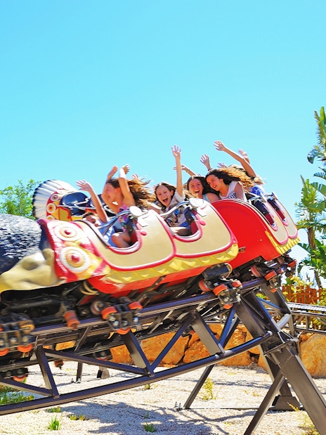 Roller coaster ride with people at Zoomarine Algarve.