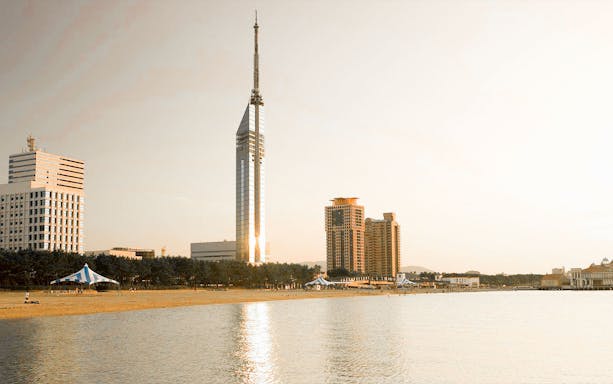 Fukuoka Tower with beach and cityscape in Fukuoka, Japan.