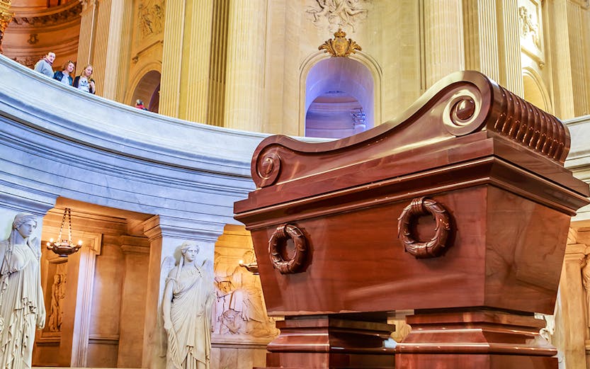 Tomb of Napoleon in Les Invalides, Paris, with ornate architecture and statues.
