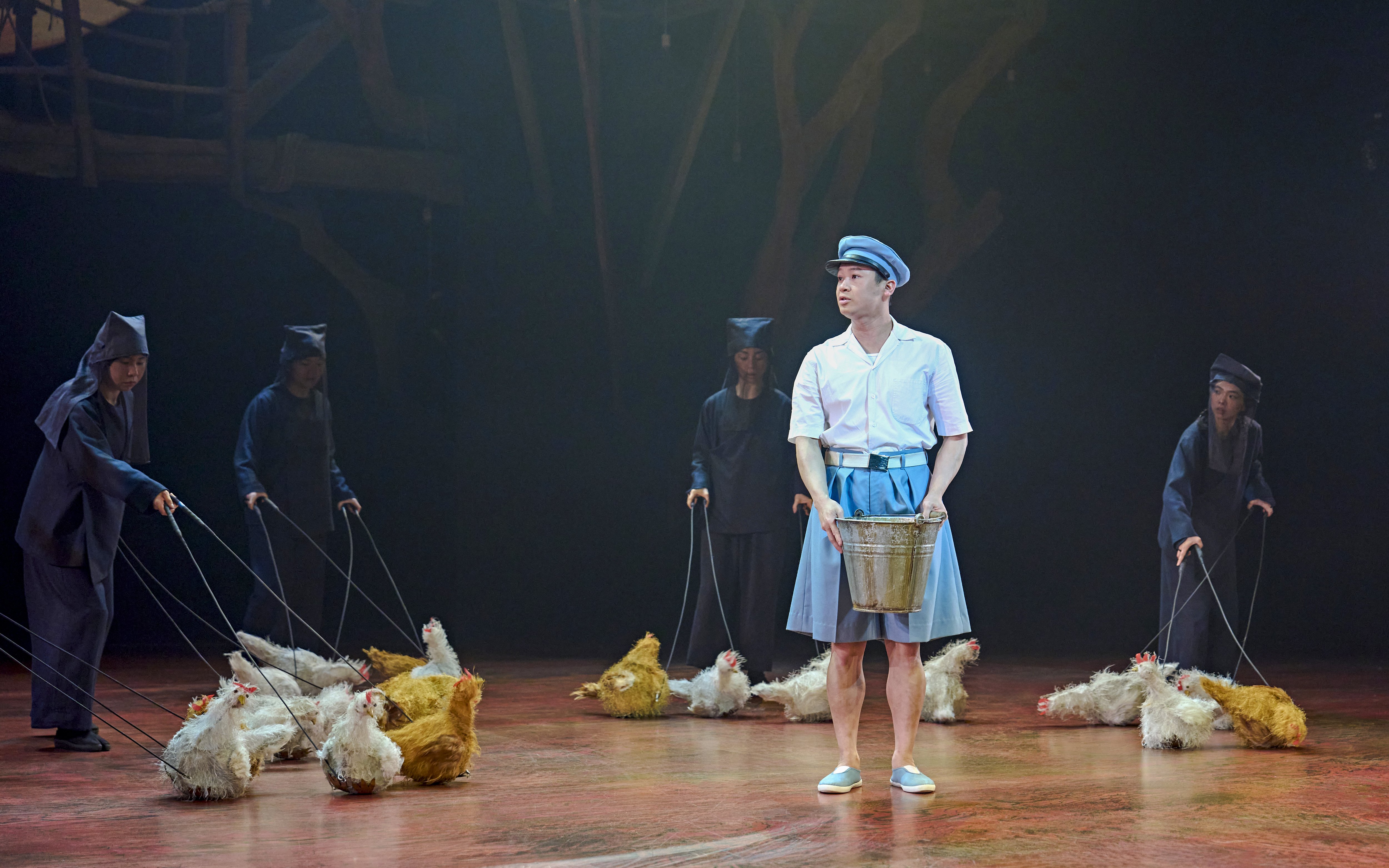 Stage performance of My Neighbour Totoro with actors and puppet chickens.