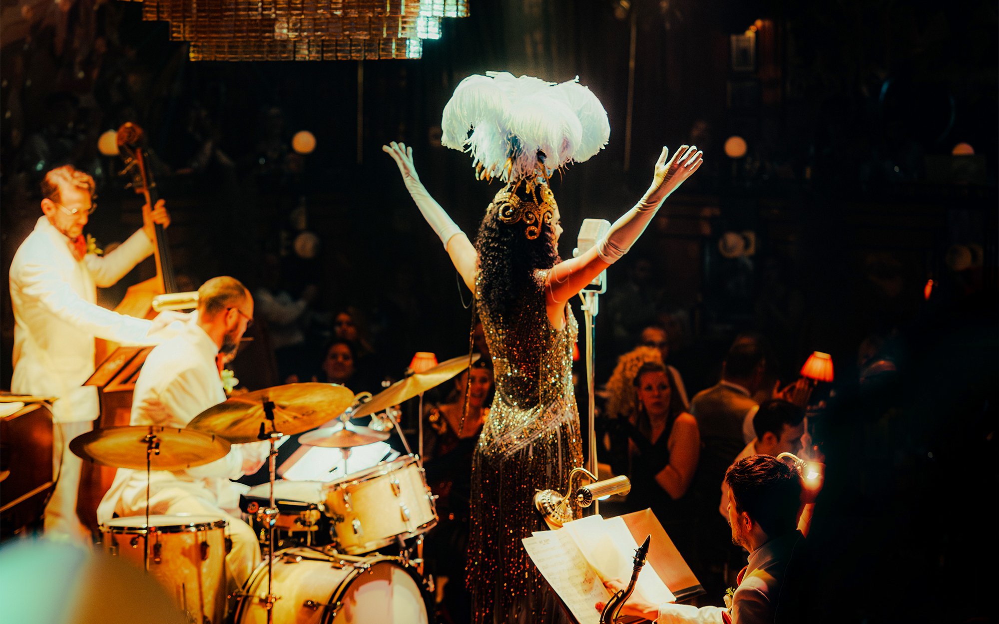 Performer on stage with band at 58th Street show, New York City.