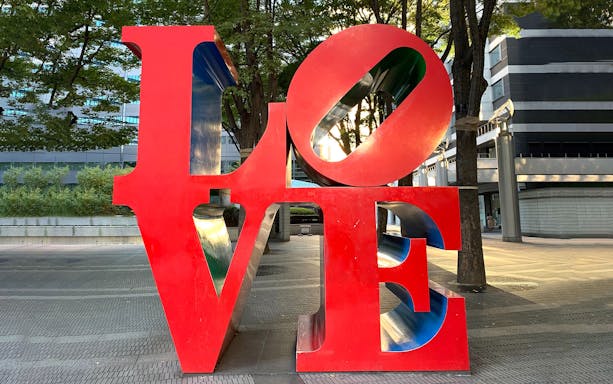 Red "LOVE" sculpture in Shinjuku, Tokyo, part of Mt. Fuji and Hakone 1 Day Bus Tour.