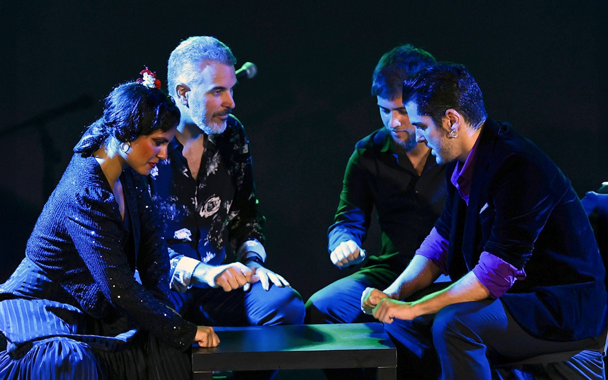 Performers at Tablao Flamenco Alma engaged in a rhythmic hand-clapping sequence.