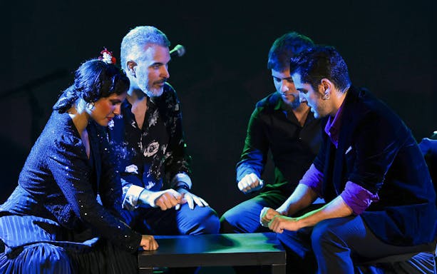 Performers at Tablao Flamenco Alma engaged in a rhythmic hand-clapping sequence.