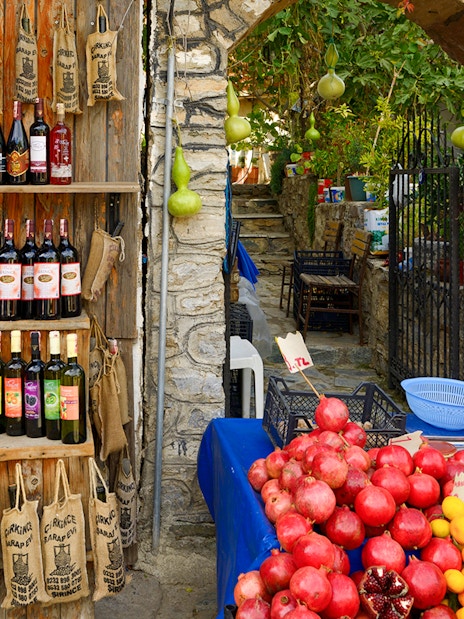 Wine bottles and fresh produce at a shop during Vineyard & Wine Tasting tour in Cappadocia.