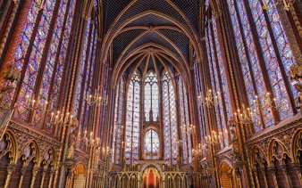Stained glass windows and vaulted ceiling inside Sainte Chapelle, Paris.
