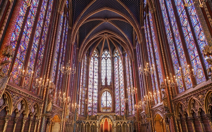 Stained glass windows and vaulted ceiling inside Sainte Chapelle, Paris.