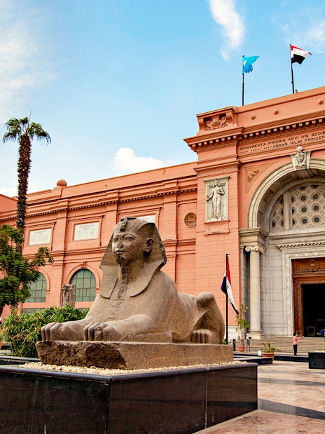 Sphinx statue in front of the Egyptian Museum entrance in Cairo, Egypt.