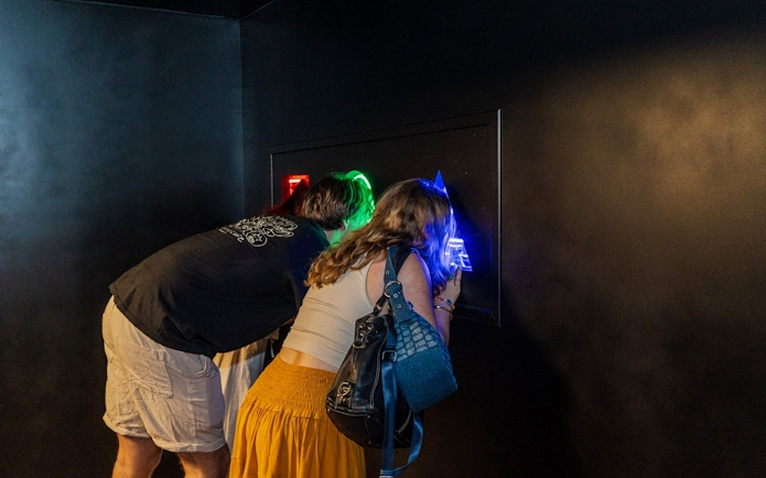 Guests exploring interactive exhibit at Museum of Illusions Amsterdam.