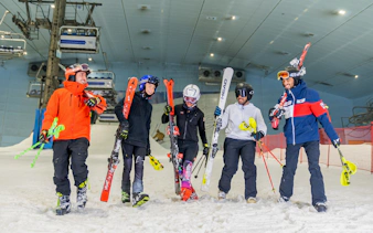 Group skiing at Ski Dubai indoor slope.