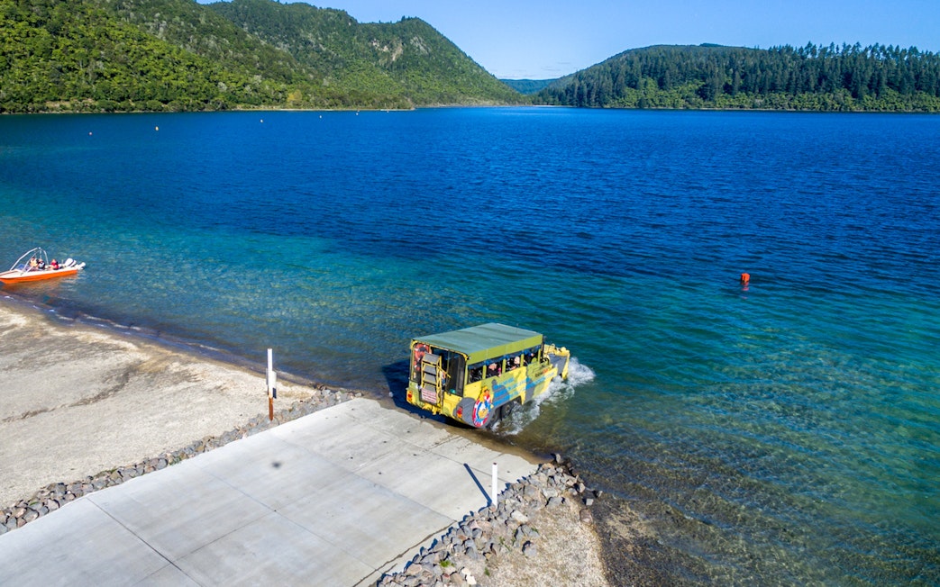 Amphibious vehicle entering Lake Rotorua during city and lakes tour.