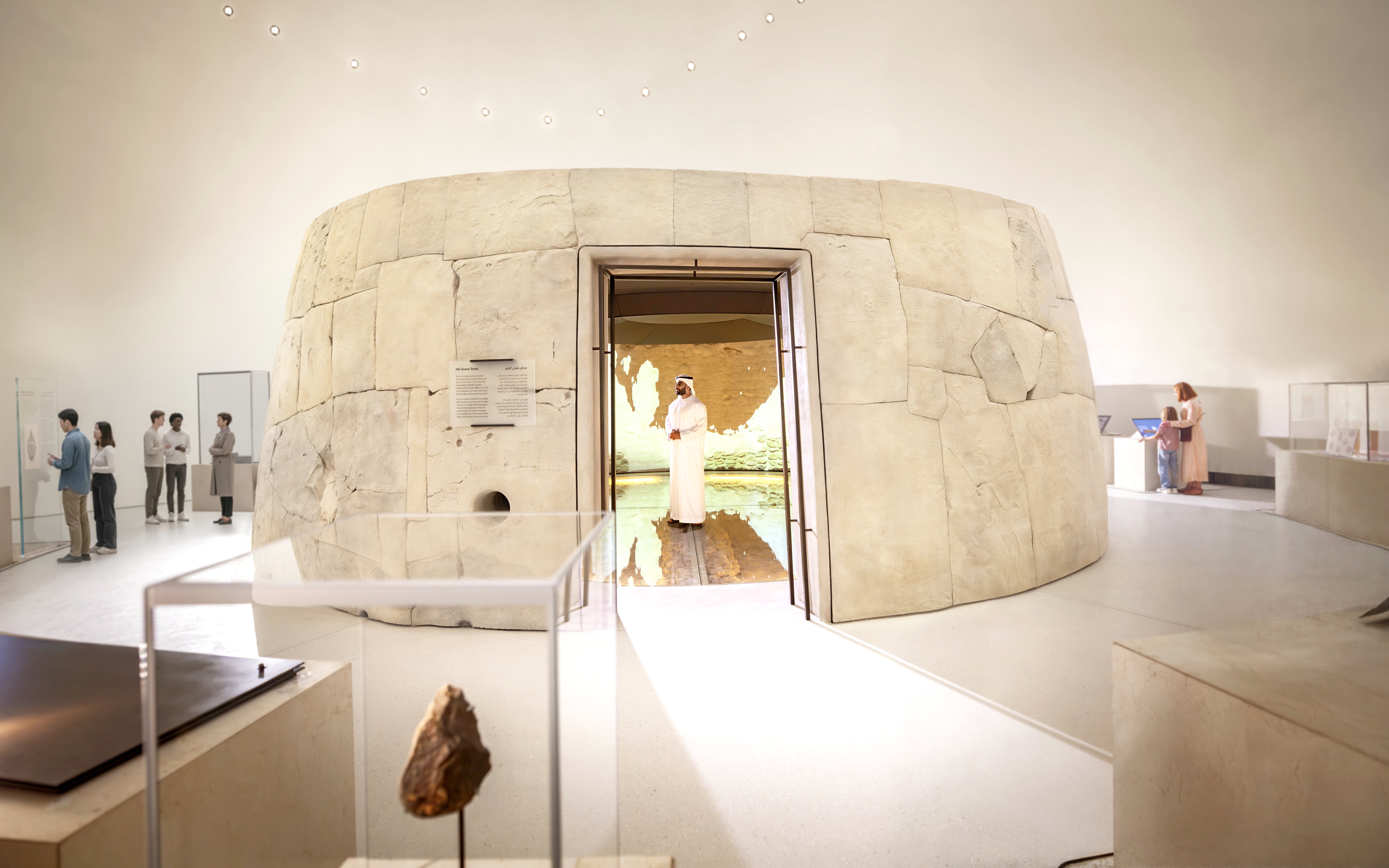 Zayed National Museum exhibit with visitors exploring ancient artifacts, Abu Dhabi.