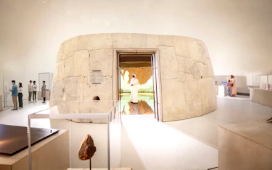 Zayed National Museum exhibit with visitors exploring ancient artifacts, Abu Dhabi.