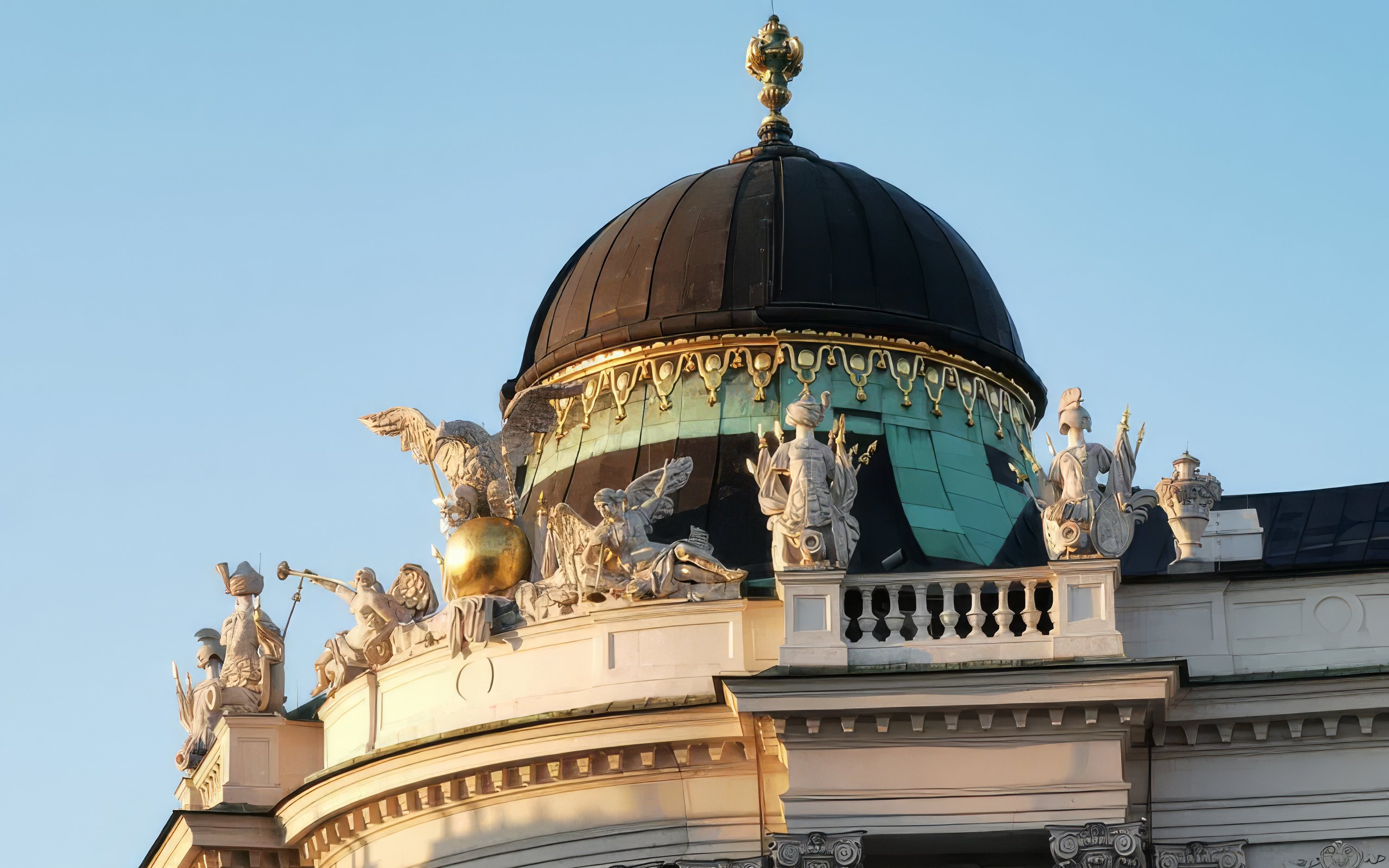 Hofburg Palace dome with ornate sculptures, Vienna, Austria.
