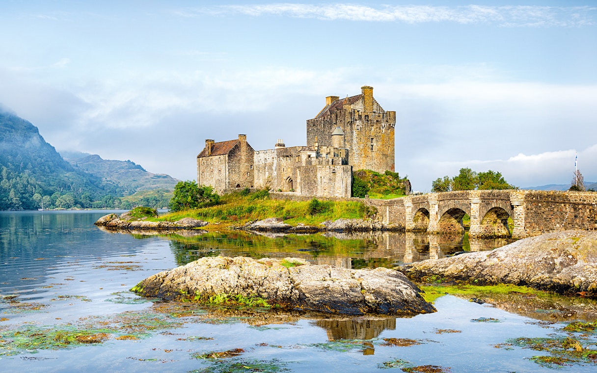 Eilean Donan Castle by the water on the Isle of Skye, Scotland.