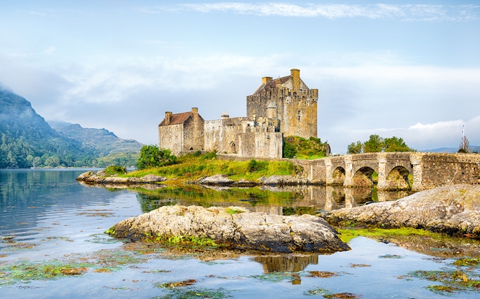 Eilean Donan Castle by the water on the Isle of Skye, Scotland.