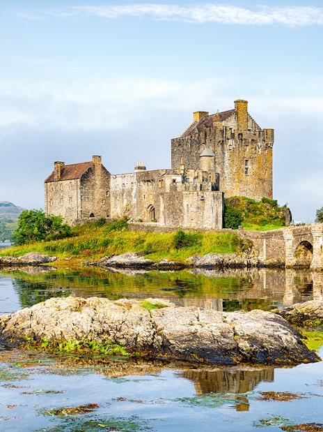 Eilean Donan Castle by the water on the Isle of Skye, Scotland.