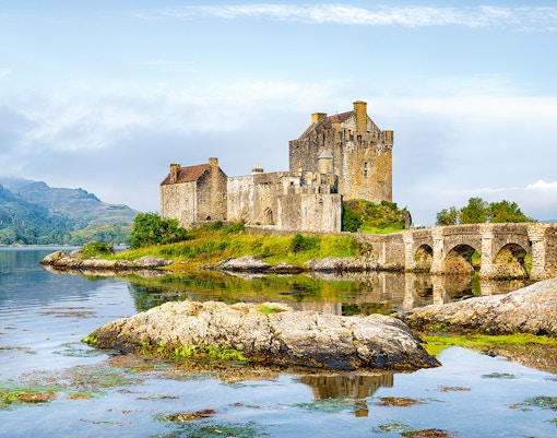 Eilean Donan Castle by the water on the Isle of Skye, Scotland.