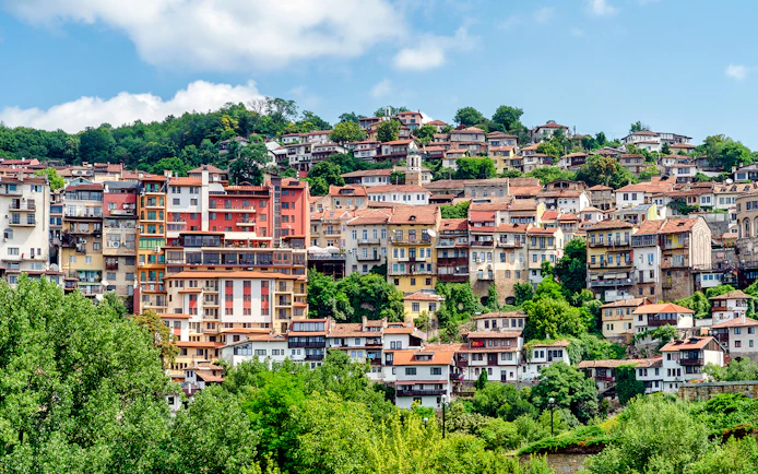 Hillside view of traditional houses in Veliko Tarnovo, Bulgaria.
