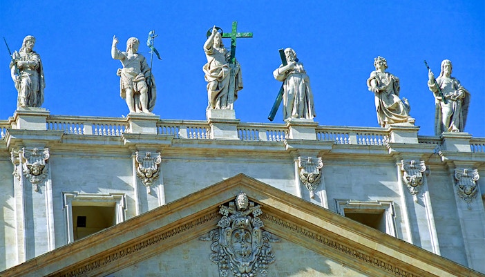 Visitors exploring the Vatican Grottoes beneath St. Peter's Basilica, Rome.