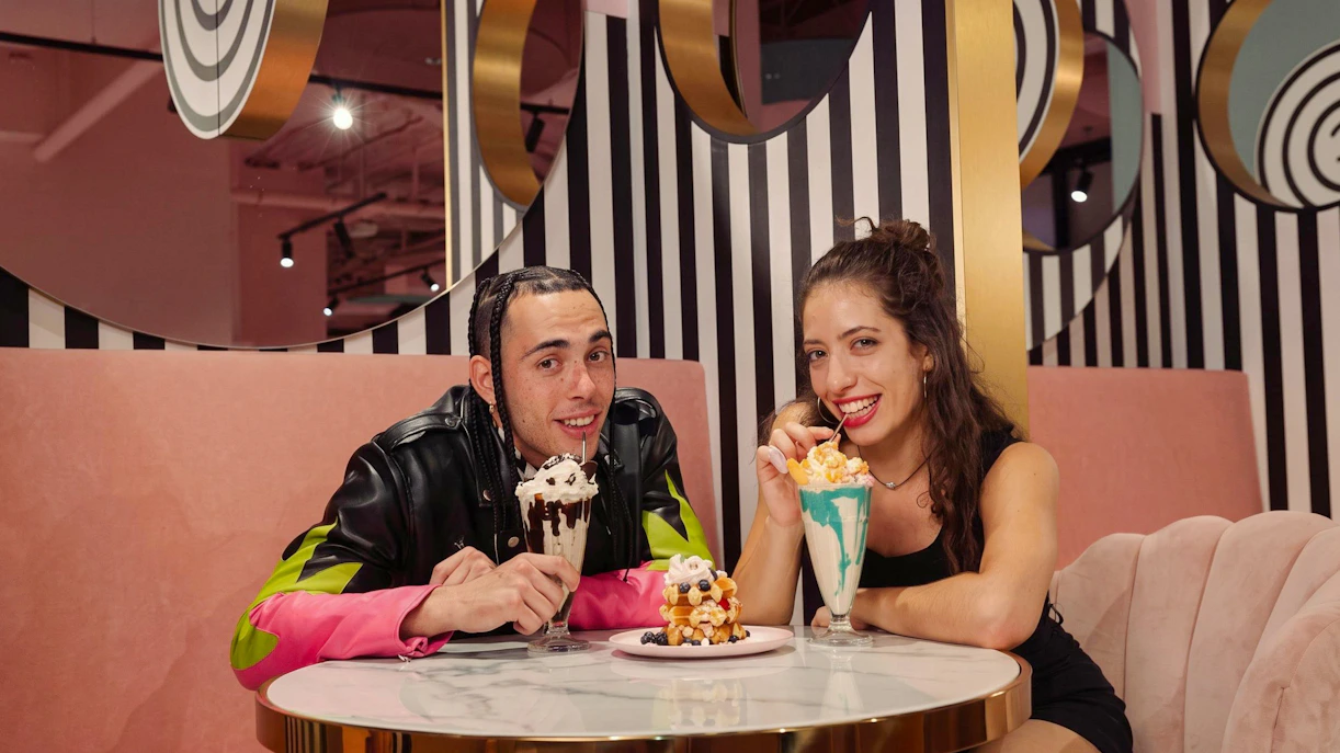Guests enjoying milkshakes and snacks at Upside Down Berlin.