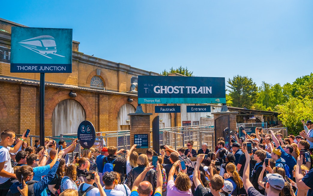 Crowd gathered at Thorpe Park's Ghost Train entrance.