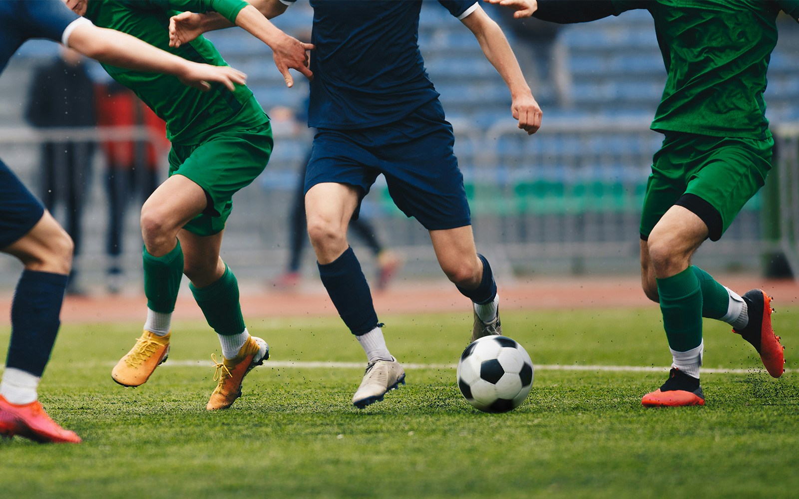 Fans watching a football match at a stadium in Barcelona, Spain.