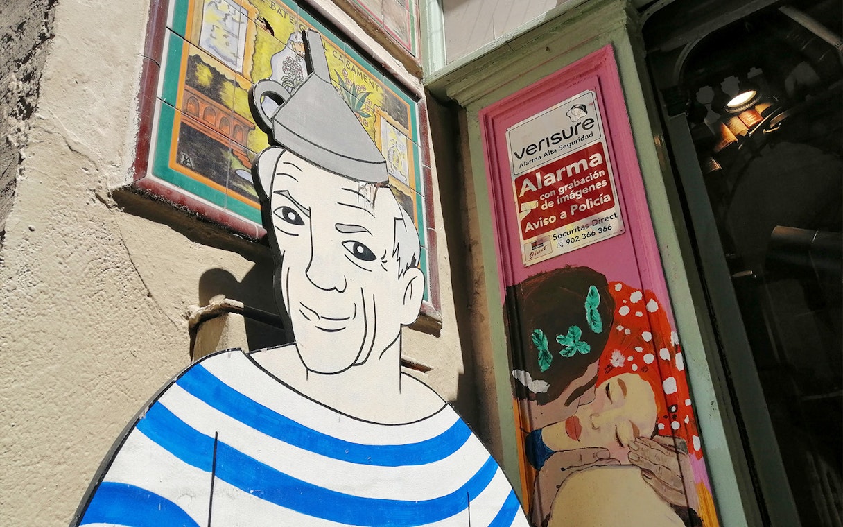 Picasso mural on a Barcelona street during the walking tour with museum entry.